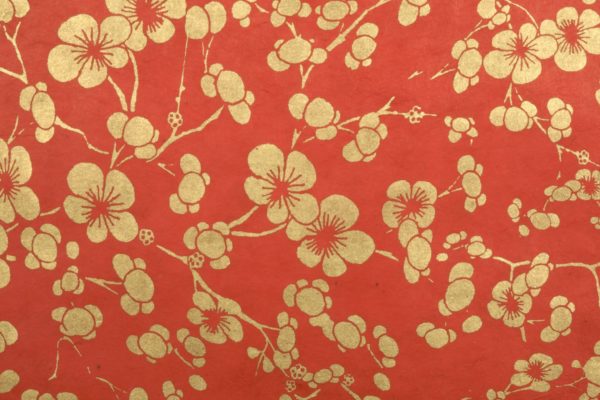 Gold cherry blossom on red paper