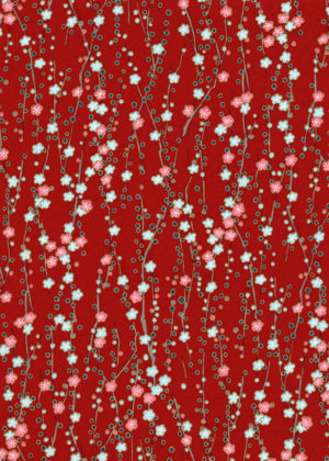 Cherry branch on red paper
